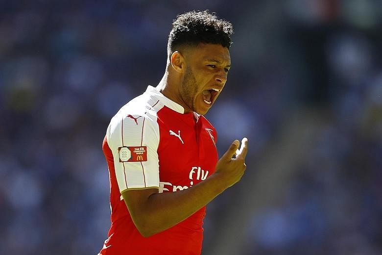 Alex Oxlade-Chamberlain is aware it's still early days yet but feels the squad are the most confident and serious in his time.