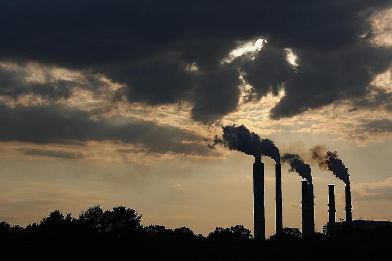 Emissions rising from stacks of a power plant in Indiana on July 23. Mr Obama's Plan is meant to put the US in a strong position at climate talks in Paris.