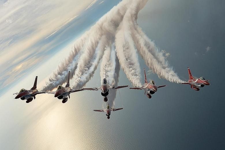 Six F-16C Fighting Falcons, one united team. These are the Black Knights - the Republic of Singapore Air Force (RSAF) aerobatics team - flying in formation over the South China Sea. 	This year's team, the 14th in the RSAF's history, was formed six mo