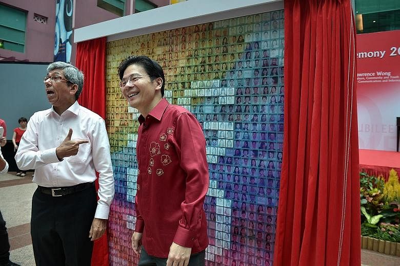 Dr Yaacob Ibrahim with Mr Lawrence Wong during the unveiling of the SG50 Mural Wall at the joint National Day Observance Ceremony held at the Old Hill Street Police Station yesterday.