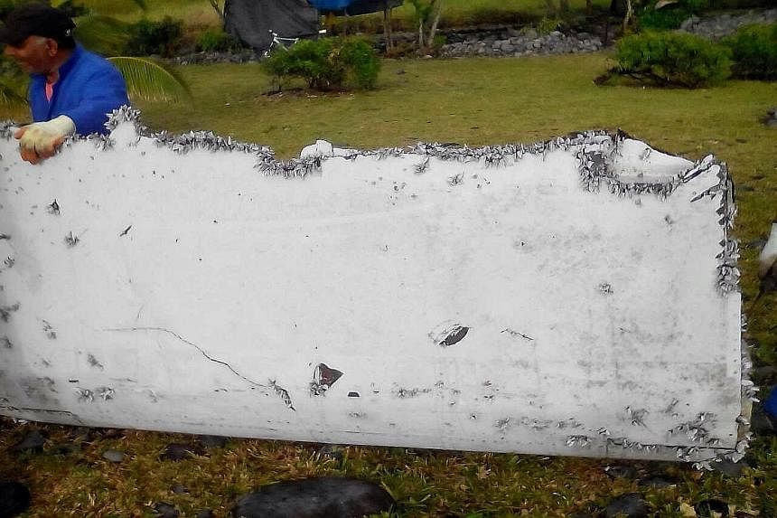 Left and above: The 2m-long flaperon from a Boeing 777 that washed up on Reunion Island last week has been confirmed to be part of the missing Malaysia Airlines MH370. Further tests could provide important clues on the flight's final moments. Ecologi