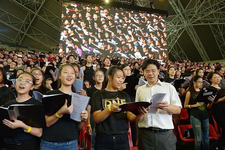 Mr Lawrence Wong made an impromptu decision to sing with the choir members last night during rehearsals for the Sing50 concert. Mandopop star JJ Lin (foreground) and Chinese pianist Lang Lang (background), seen here practising during the rehearsals l