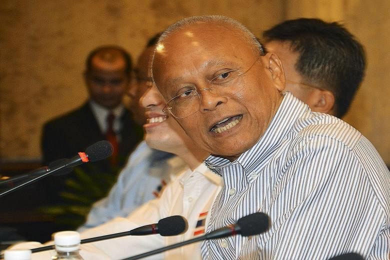 Mr Suthep Thaugsuban holding a press conference in Bangkok on July 30. His call for reforms may help the junta stay in power but an extended term may show up the failings of the Thai generals.
