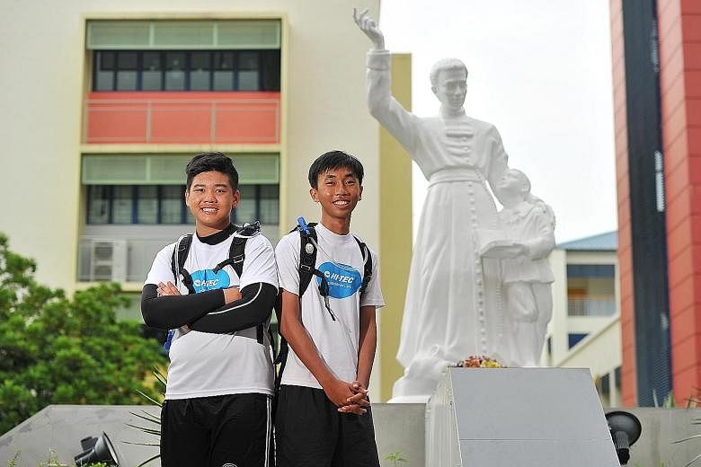 Students Ethan Teo (far left) and Jackies Low, members of the group that went on the 300km charity trek to mark 300 years of the international Catholic institution Brothers of St Gabriel. The institution set up six schools in Singapore.