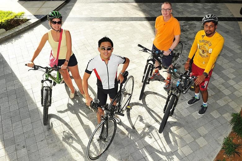 Capri by Fraser's general manager Vernon Lee (in white) with hotel guests (from left) Rosemarijn Kriek, John Maxwell and Santosh Kumar Podishetti, 29, before they set off on their tour of the Changi area. Mr Lee conducts such free, informal cycling t