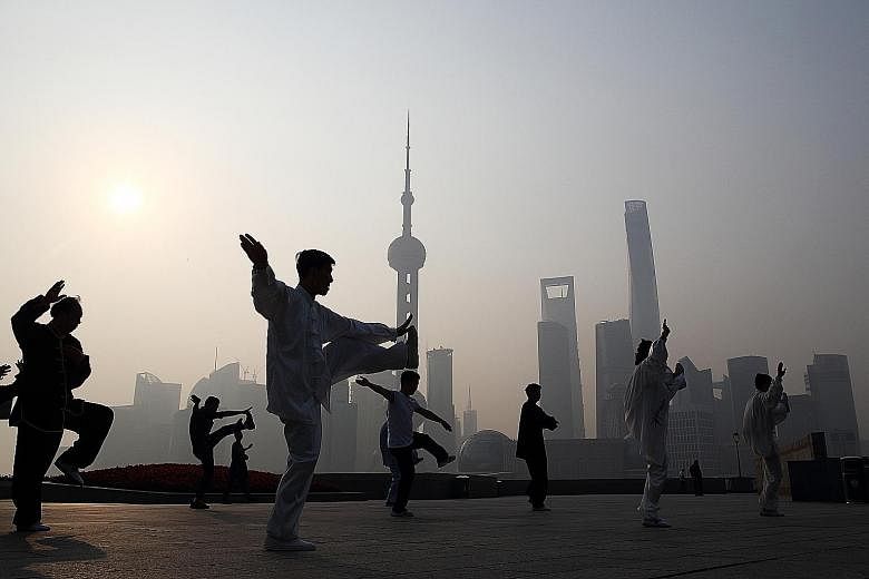 People doing taiji in Shanghai's Bund area. The reversal of fortunes has helped cull riskier lenders in China's online market, which was surging before the equity rout wiped out more than US$4 trillion (S$5.5 trillion). President Xi Jinping has alrea