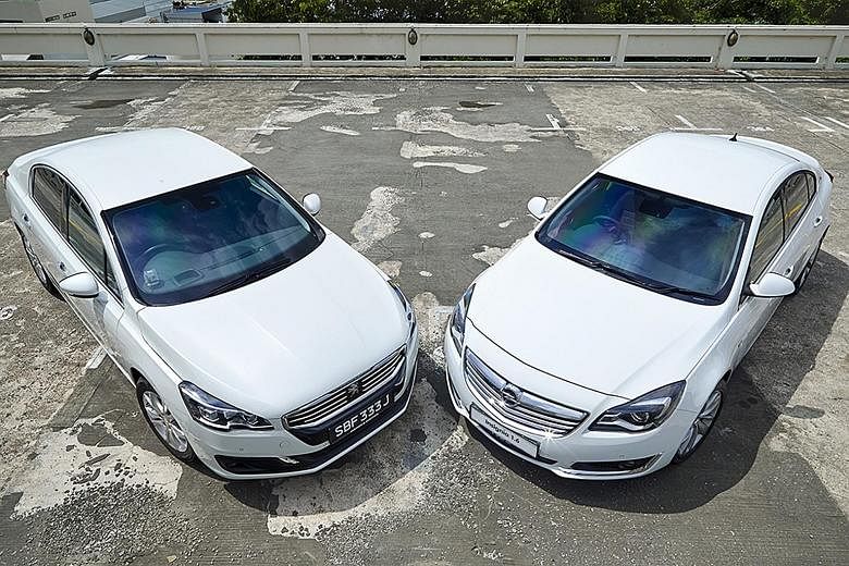 The Peugeot 508 (far left) and the Opel Insignia (left).