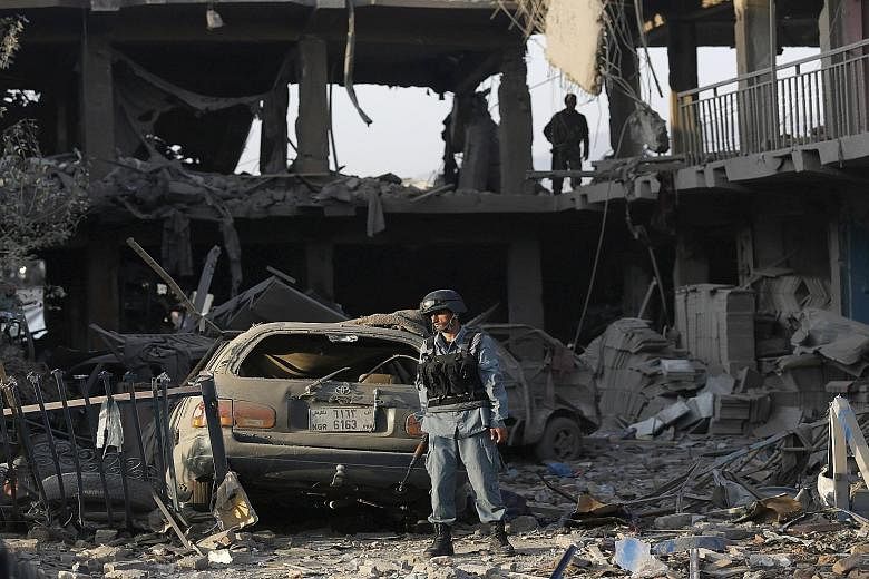The force of the explosion in the neighbourhood of Shah Shaheed in Kabul yesterday reduced the front of nearby buildings to rubble. Officials were searching for anyone trapped under the debris, and said that the number of wounded could run into the h