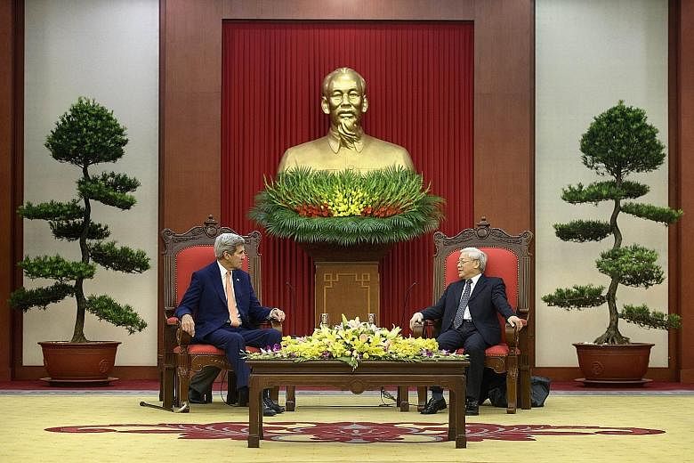 Mr Kerry (left) meeting Vietnam Communist Party general secretary Nguyen Phu Trong in Hanoi.