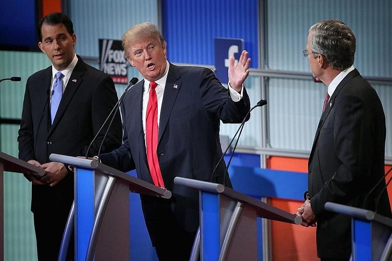Among the 10 Republican presidential hopefuls in the prime-time debate on Thursday in Cleveland were (from left) Wisconsin Governor Scott Walker, Mr Donald Trump and former governor Jeb Bush. The candidates were selected based on their ranking in the