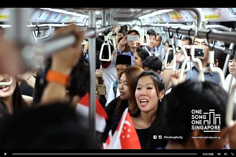 A video of commuters participating in a flash mob event on a crowded train, singing along to the National Day favourite Home, has garnered more than 330,000 views.