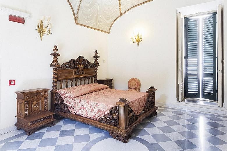 Villa Torlonia had many spaces used by former Italian leader Benito Mussolini, including this bedroom (left).