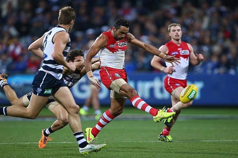 Adam Goodes of the Sydney Swans attempting a shot on goal against the Geelong Cats on Saturday, a game which his team lost by 32 points. Most fans sympathise with his plight and back him, and the stadium was sold out for the first time in two years f