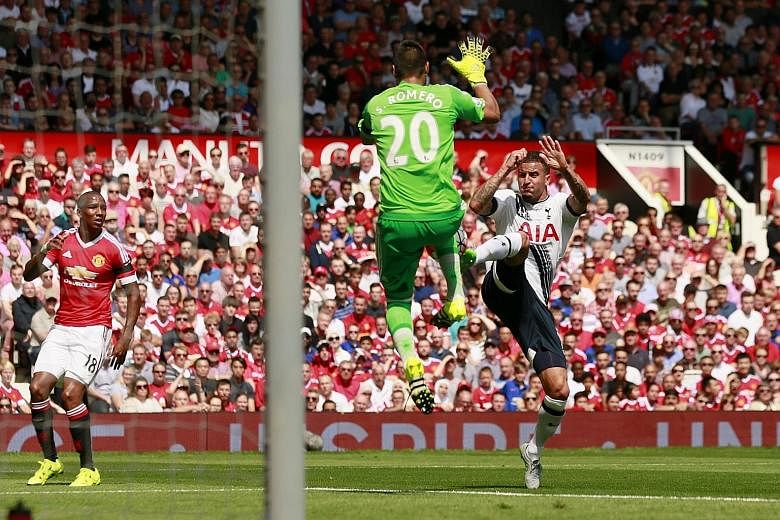 Kyle Walker putting pressure on United goalkeeper Sergio Romero, who impressed on his debut. The Tottenham defender's own goal gave United a 1-0 win.