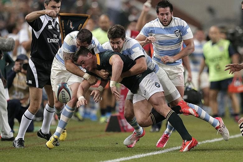South Africa's full-back Jesse Kriel (centre) is tackled during the 25-37 Rugby Championship Test match loss to Argentina in Durban on Saturday. The defeat, the first at the hands of the Pumas in 22 years, followed losses to Australia and New Zealand