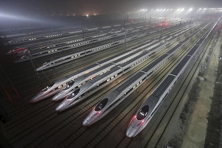 High-speed bullet trains at a maintenance base in Wuhan, Hubei province, China, in a 2012 file photo. China has already merged its top two train makers - China CNR Corp and CSR Corp - which are state-owned, into the single conglomerate CRRC Corp, in 