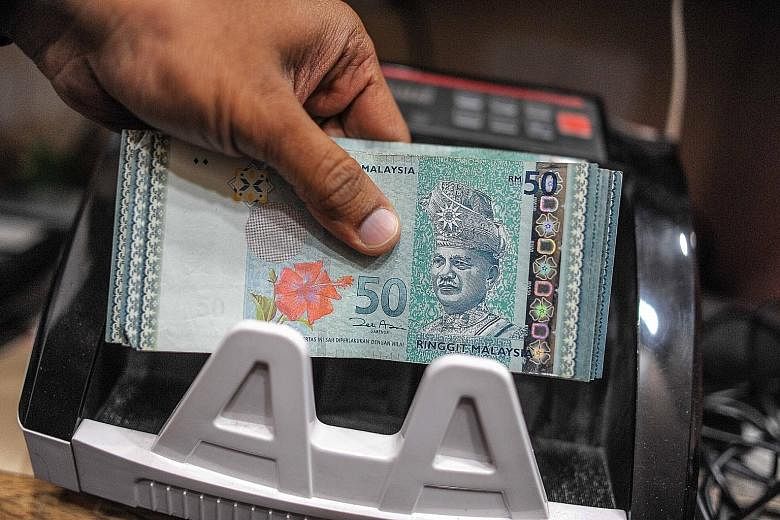The ringgit yesterday fell to 3.9300 per US dollar, the weakest level since Sept 2, 1998, the day before the government pegged it at 3.8000 per dollar to put a floor under the unit in the Asian financial crisis.