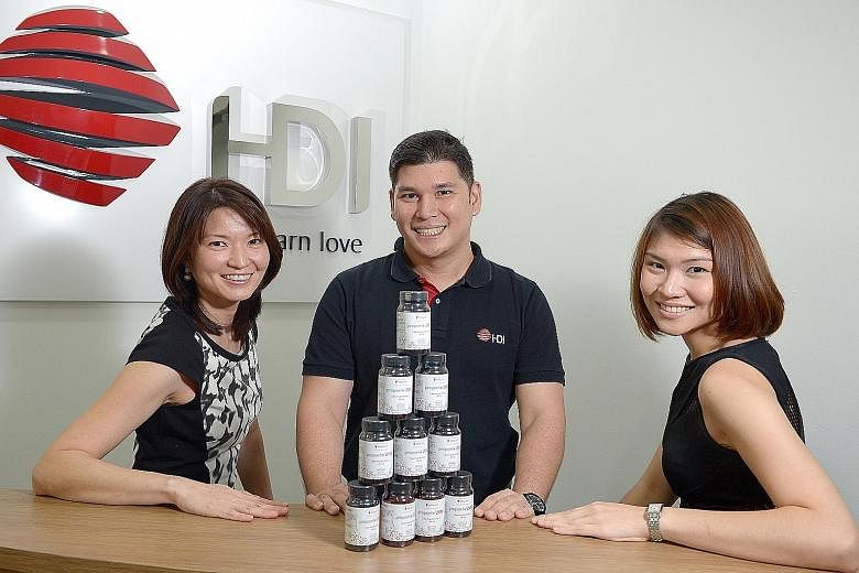 HDI Group chairman Brandon Chia, 37, with his sisters, Dr Chia Su-Ynn (left), 40, and Ms Chia Su-Mae, 26. Their father, company founder Peter Chia, 67, started distributing bee products in 1986 to provide for his family and the siblings gradually got