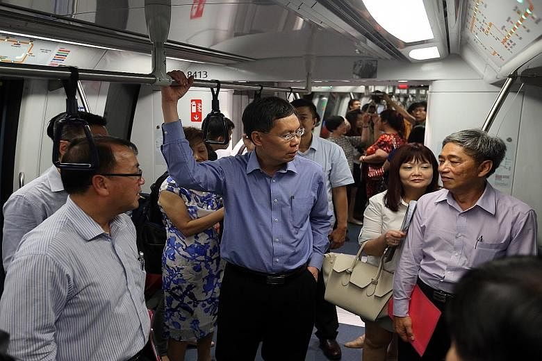 Mr Lui Tuck Yew (centre) often travelled on public transport on his own to see the conditions for himself. MP Liang Eng Hwa said in 2011, Mr Lui rode on the Bukit Panjang LRT system during the June school holidays and it was not as crowded as expecte