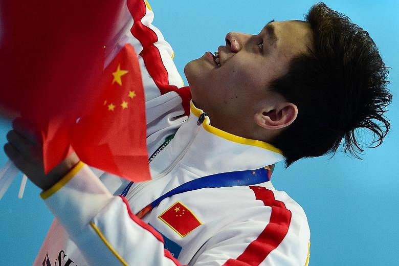 China's Sun Yang celebrates with fans after winning the 800m freestyle in Kazan last Wednesday. The decision by Fina to name Sun as the top male swimmer of the World Championships was widely criticised.
