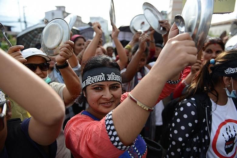 Activists in Nepal banged plates and spoons on Monday as they took part in a protest in Kathmandu to demand equal citizenship rights in the new Constitution. Nepal's Parliament is proposing to bar all single parents from passing on their citizenship 