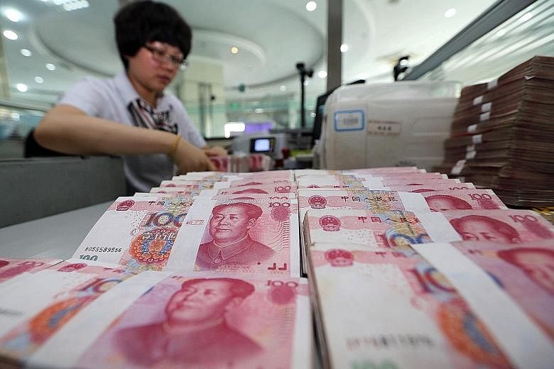 China's central bank yesterday cut its daily reference rate for the yuan by a record 1.9 per cent, calling the change a one-time adjustment.