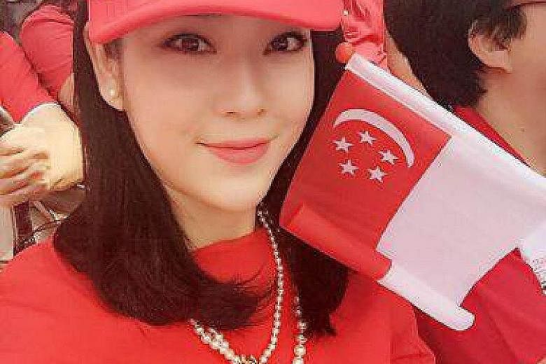 Ms Emma Lee, 29, who is from Chengdu, was spotted waving the Singapore flag enthusiastically (left) during Sunday's National Day Parade.