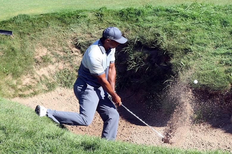 Tiger Woods hits out of a bunker on the ninth hole during a practice round for the US PGA Championship at Whistling Straits. Woods, who is ranked 278th in the world, says the world No. 1 has the necessary talent and the mental attitude, but the physi