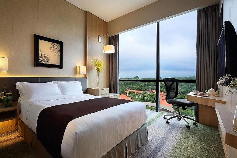 A twin-bed guestroom (top) at Ramada Singapore (above left) in Balestier. On the right is Days Hotel Singapore. An artist's impression of the upcoming Hotel Indigo Singapore Katong and Holiday Inn Express Singapore Katong (both right). A deluxe suite