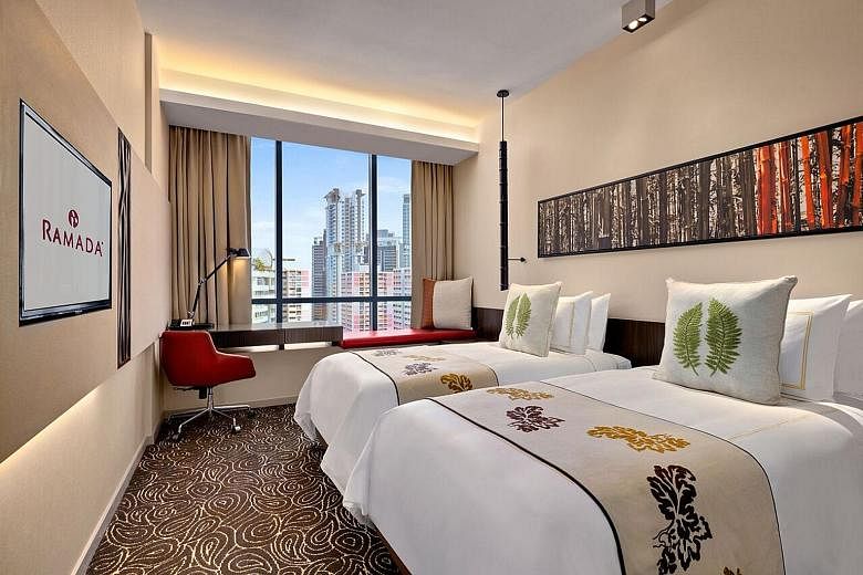 A twin-bed guestroom (top) at Ramada Singapore (above left) in Balestier. On the right is Days Hotel Singapore. An artist's impression of the upcoming Hotel Indigo Singapore Katong and Holiday Inn Express Singapore Katong (both right). A deluxe suite