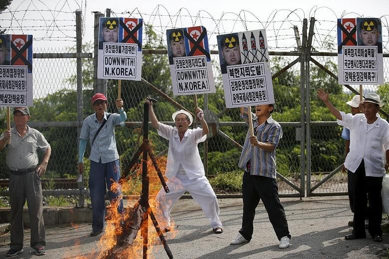 Activists chanting slogans during an anti-North Korea rally near the demilitarised zone separating the two Koreas in Paju, South Korea, on Tuesday.