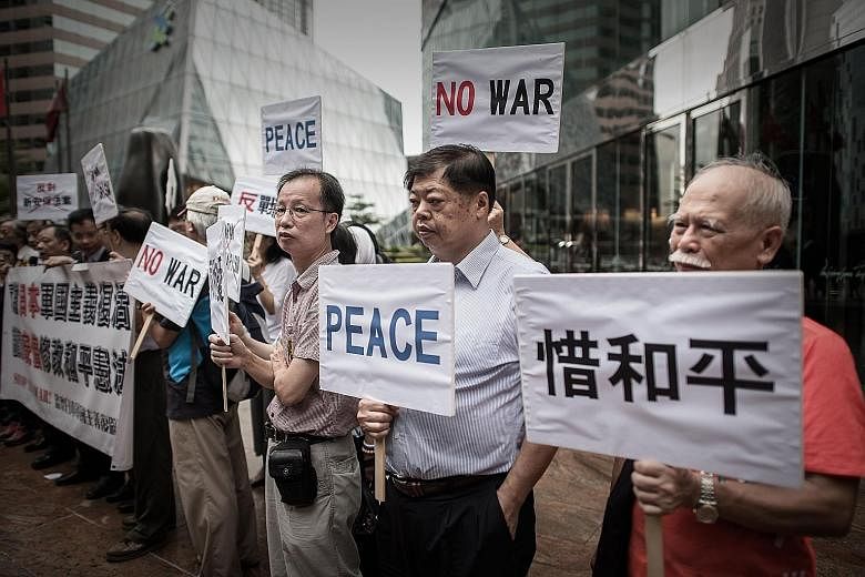 A rally outside the Japanese consulate in Hong Kong yesterday, the day Japanese Premier Shinzo Abe made a statement ahead of the 70th anniversary of the end of World War II.