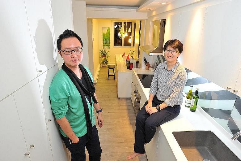 An open space beyond the kitchen is where the home owner takes her breakfast daily. Home owner Faith Goh (left) and interior designer Vincent Goi (far left), who was behind the look of her home. (Above) Ms Goh's bedroom. (From far left) Different sea