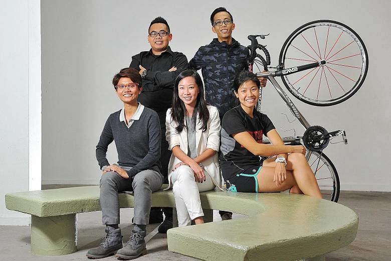 (From left, seated) Ms Nur Uzaimah Fadzali, Ms Patricia Yee and Ms Tan Peining, and (from left, standing) ex-Club Rainbow (Singapore) beneficiaries Muhammad Sharil Abdul Hamid, 25, and Muhammad Azrin Ali, 26, will cycle in the Ride for Rainbows event