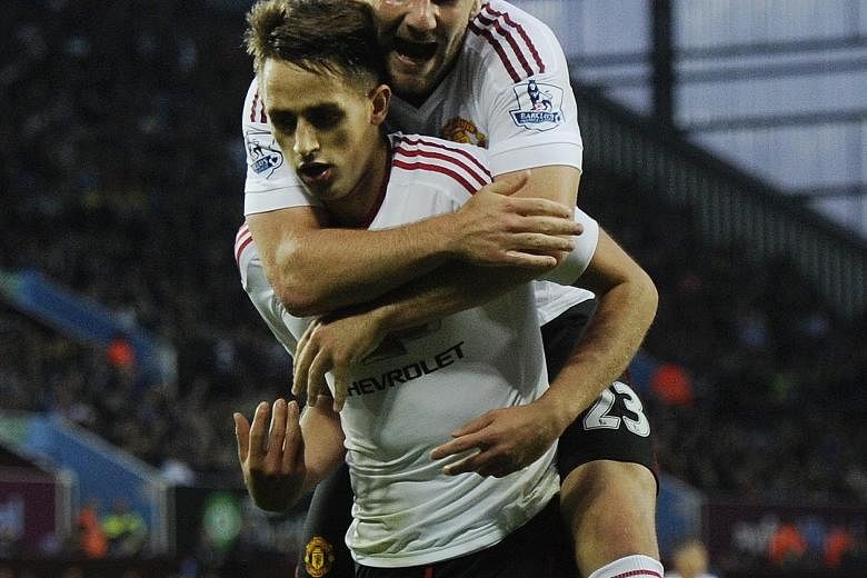 Adnan Januzaj (front) celebrating with team-mate Luke Shaw after scoring against Villa during a rare start. The Belgian later denied talk that he wanted to leave and pledged to fight for a regular place.