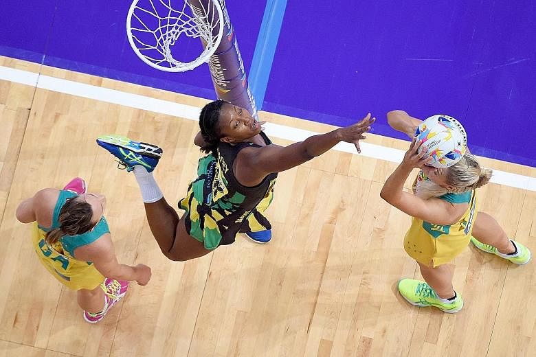 Caitlin Bassett (right) of Australia shooting against Jamaica's Stacian Facey in the hosts' 67-56 World Cup semi-final win. The pace and physicality of non-Asian teams are a major challenge for Singapore.