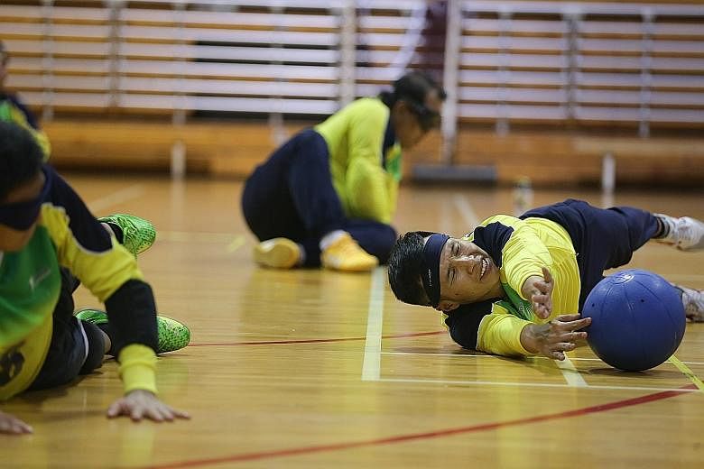 Kelvin Tan (foreground) at a training session for goalball. This team sport for blind athletes will be included in the Asean Para Games in Singapore from Dec 3-9.