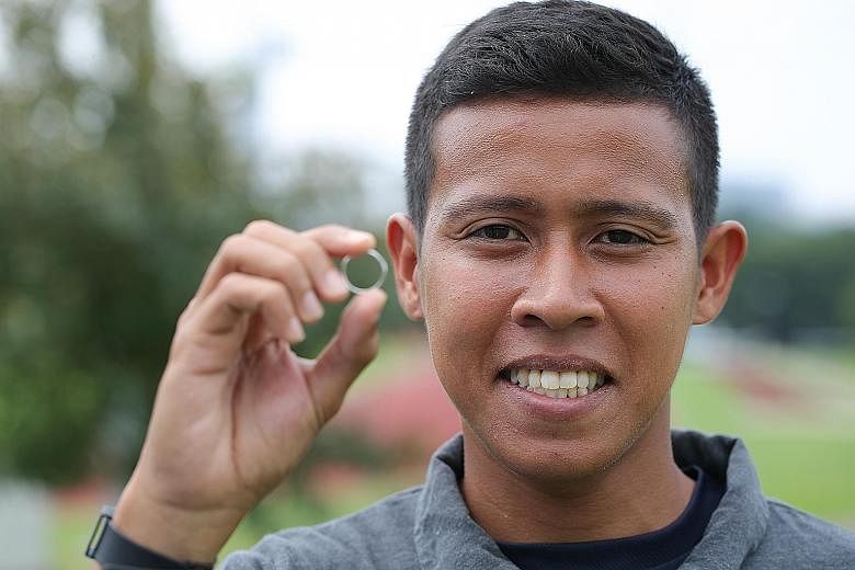 Full-time national serviceman Aliff Noor Hakim, 24, found the wedding ring engraved with the name Collin Toh at a bus stop in Eunos. He tracked down Mr Toh on Facebook and returned the ring last month.