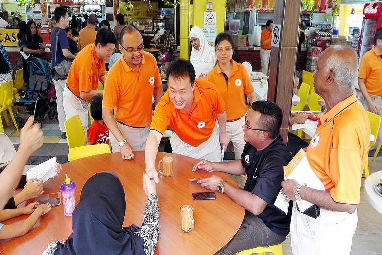 NSP members (from left) Sebastian Teo, Mohamed Fazli Talip, Lim Tean and Hazel Poa going on a walkabout in Tampines East yesterday. Tampines will be an "area of focus" for the NSP, said party leaders.