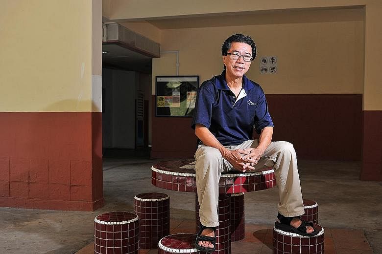 Mr Bernard Chiang, 64, chairman of Braddell Heights Inter-racial and Religious Confidence Circle, at the void deck of Block 5, Lorong Lew Lian, where he had mediated between a Chinese family holding a wake and a Malay family hosting a wedding ceremon