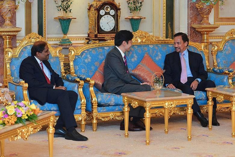 Minister for Culture, Community and Youth and Second Minister for Communications and Information Lawrence Wong (centre) having an audience on Saturday with Sultan Hassanal Bolkiahof Brunei. Mr Wong conveyed birthday greetings from Singapore's leaders