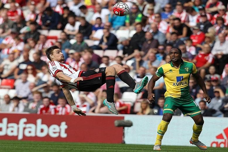 Sunderland defender Sebastian Coates (left) using a bicycle kick to get the ball away from Norwich striker Cameron Jerome. Sunderland fans, though, would hope the Black Cats can avoid the spectacular and get the basics right as the team are rooted to