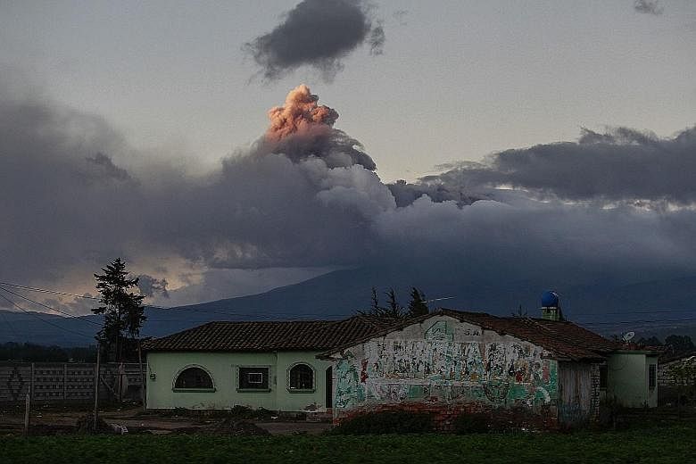 Giant plumes of ash and dust spewing from the Cotopaxi volcano, as seen from nearby Saquisili village last Saturday.