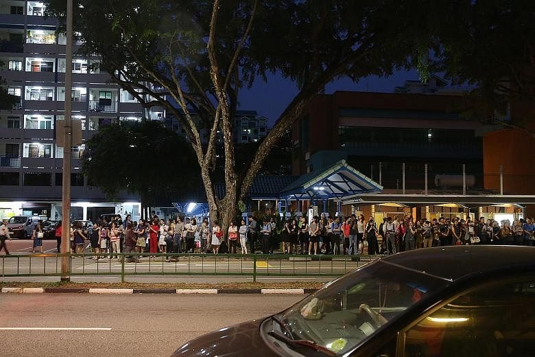 The crowd at a bus stop outside Braddell MRT station on July 7, after a massive breakdown on the North-South and East-West lines.