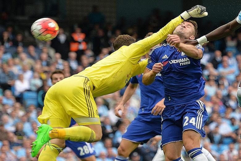 Chelsea defender Gary Cahill ends up with a bloody nose after goalkeeper Asmir Begovic tries to punch the ball clear during the match with Manchester City.