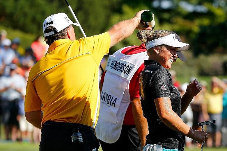 Canadian teen golfer Brooke Henderson is not yet of legal age to consume alcohol but she has no qualms being showered with champagne after her commanding eight-stroke win at the Portland Classic.