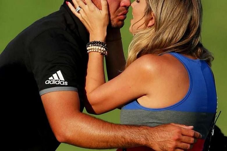 An emotional Jason Day celebrating his PGA Championship triumph with his wife Ellie at Whistling Straits. His 20-under 268 total is the lowest score relative to par in a Major. The Australian has climbed to No. 3 in the world rankings. 