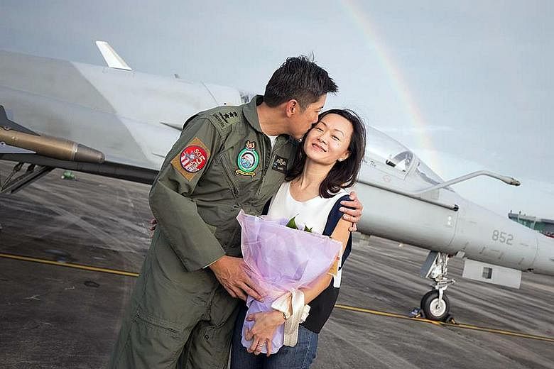 Lieutenant- General Ng Chee Meng, the outgoing Chief of Defence Force, with his wife Michelle after his final flight on the F-5 last week. The father of two, who took a few months to decide on whether he wanted to enter politics, believes he has the 
