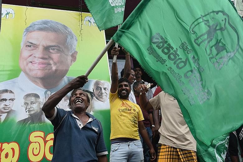 Supporters of Prime Minister Ranil Wickremesinghe are all smiles following the general election. The ruling United National Party (UNP) was short of a majority in the 225-member assembly but has enough seats to form a government. The alliance led by 