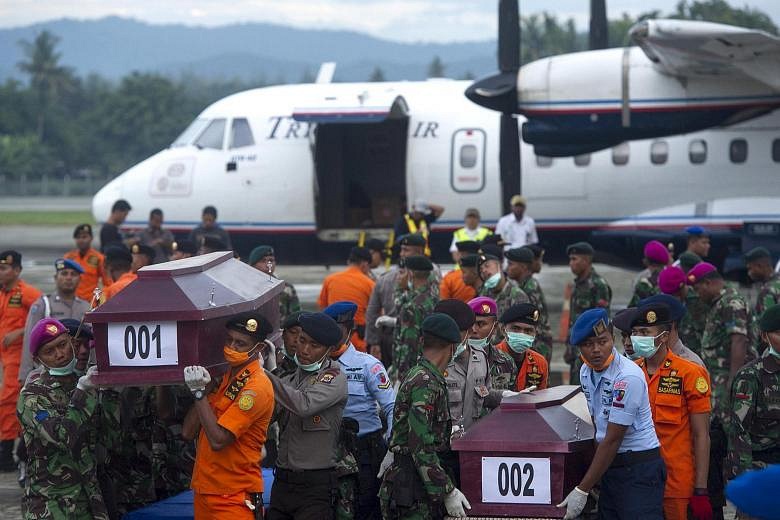 First Bodies Recovered From Indonesia Plane Crash Site | The Straits Times